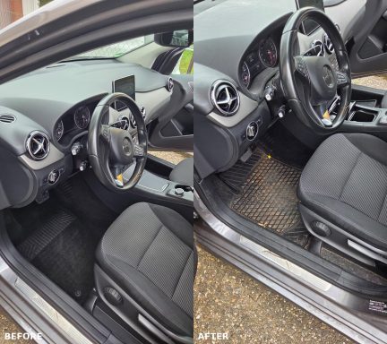 Innenansicht eines Autos mit schwarzem Sitz und Lenkrad, links und rechts geteilt.